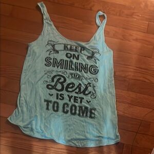 Sweet Claire Women's Oversized Medium Graphic Tank Top
“The Best is Yet to Come”